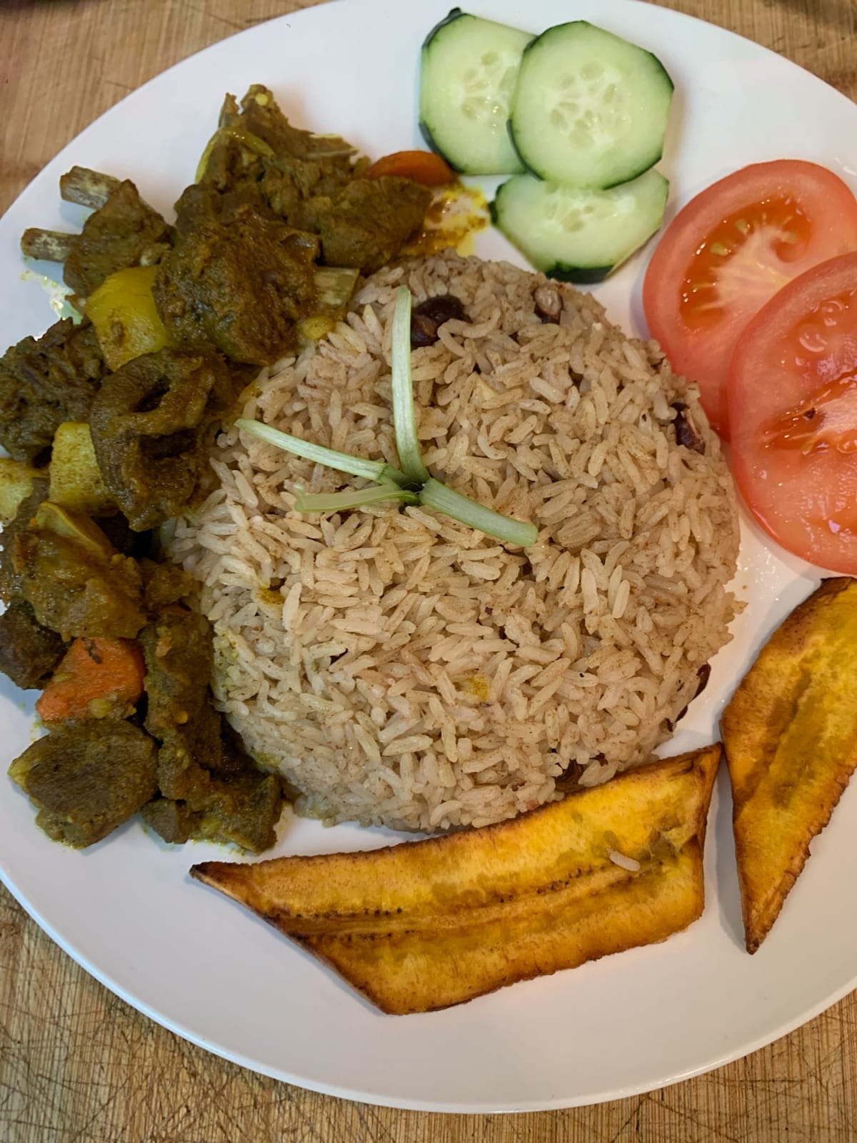 Curry goat with rice and peas